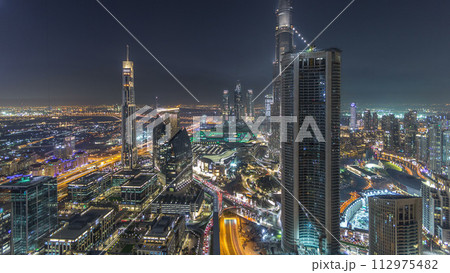 Dubai Downtown night timelapse modern towers panoramic view from the top in Dubai, United Arab Emirates. Dubai Downtown night timelapse modern towers panoramic view from the top in Dubai, United Arab Emirates. 112975482