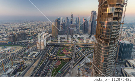 Scenic Dubai downtown skyline day to night timelapse. Rooftop view of Sheikh Zayed road Scenic Dubai downtown skyline day to night timelapse. Rooftop view of Sheikh Zayed road 112975483
