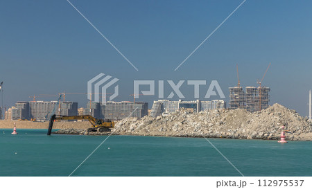 Excavator building a new part on the Palm Jumeirah timelapse 112975537