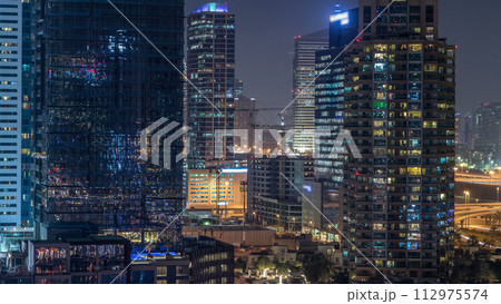 Dubai Marina at night timelapse, Glittering lights and tallest skyscrapers Dubai Marina at night timelapse, Glittering lights and tallest skyscrapers 112975574