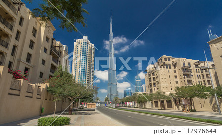 Walking on Dubai street Dubai Skyline timelapse hyperlapse. Residential and Business Skyscrapers in Downtown Walking on Dubai street Dubai Skyline timelapse hyperlapse. Residential and Business Skyscrapers in Downtown 112976644