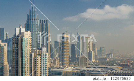 Downtown Dubai skyline with skyscrapers and towers timelapse, view from rooftop. 112976689