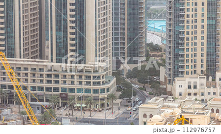 Downtown Dubai skyline with residential towers timelapse, view from rooftop. 112976757