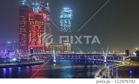 The new Dubai Water Canal with view on the city skyline timelapse, United Arab Emirates 112976792