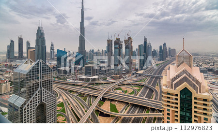 Dubai skyline timelapse at sunset with city center skyscrapers and Sheikh Zayed road traffic, Dubai, United Arab Emirates Dubai skyline timelapse at sunset with city center skyscrapers and Sheikh Zayed road traffic, Dubai, United Arab Emirates 112976823