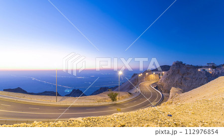 Day to night timelapse with rocks from Jebel Hafeetwith impressive view over the city. 112976854