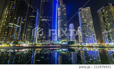 Residential buildings in Jumeirah Lake Towers timelapse hyperlapse in Dubai, UAE. 112976931