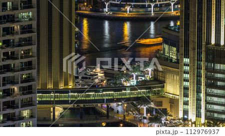 Aerial top view at night timelapse of Dubai Marina and JBR in Dubai, UAE Aerial top view at night timelapse of Dubai Marina and JBR in Dubai, UAE 112976937