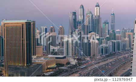 Aerial top view day to night timelapse of Dubai Marina and JLT in Dubai, UAE 112976947