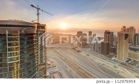 Sunset aerial top view timelapse at Dubai Marina and JLT in Dubai, UAE 112976954