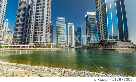 Residential buildings in Jumeirah Lake Towers timelapse hyperlapse in Dubai, UAE. Residential buildings in Jumeirah Lake Towers timelapse hyperlapse in Dubai, UAE. 112977005