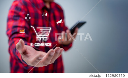 Businessman or customer hold smartphone with online shopping concept, marketplace website with virtual interface of online Shopping cart part of the e-commerce marketing network. 112980350