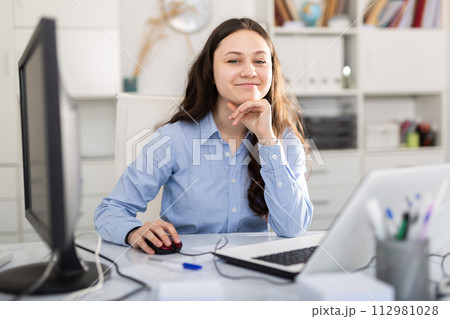 Portrait of successful business woman in office interior Portrait of successful business woman in office interior 112981028