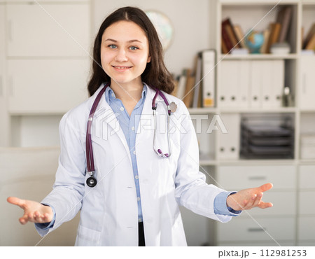 Positive female doctor posing Positive female doctor posing 112981253