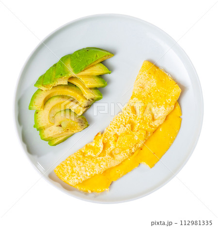 Omelet served with avocado on platter 112981335