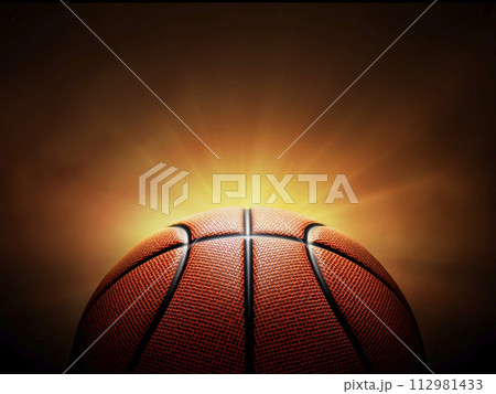 basketball ball. on black background with smoke, yellow orange red white colored back lights 112981433