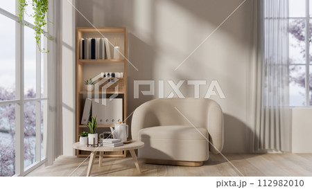 The modern neutral living room interior design with a cozy armchair, a coffee table, and decor. The modern neutral living room interior design with a cozy armchair, a coffee table, and decor. 112982010