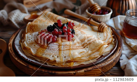 Homemade Pancakes Topped with Fresh Berries and Honey, Served on a Wooden Table. Cozy Breakfast Scene in Rustic Style. Delicious Start to the Day. AI 112983609