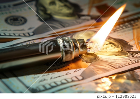 AI-generated content. Torch burning on a pile of bills AI-generated content. Torch burning on a pile of bills 112985623