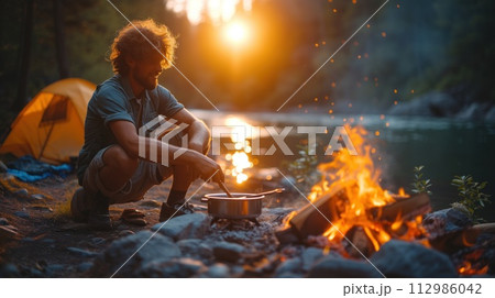 tourist cooking food on a fire 112986042