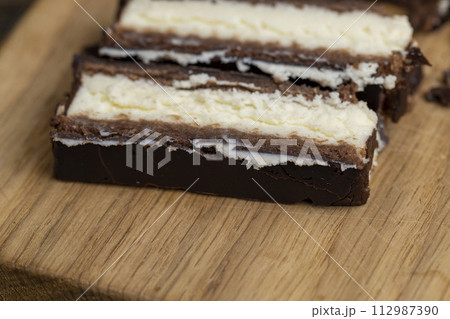 chocolate-covered sweet cookies with creamy cottage cheese chocolate-covered sweet cookies with creamy cottage cheese 112987390