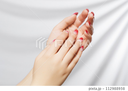 Beautiful Woman Hands. Female Hands Applying Cream Beautiful Woman Hands. Female Hands Applying Cream 112988938