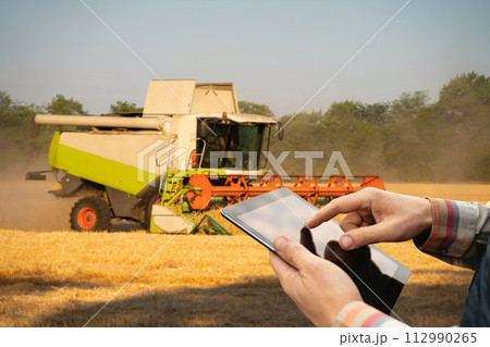 Combine harvester on the wheat field Combine harvester on the wheat field 112990265