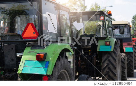 Farmers blocked traffic with tractors during a protest 112990494