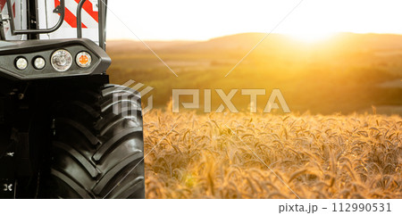 Combine harvester on the wheat field Combine harvester on the wheat field 112990531
