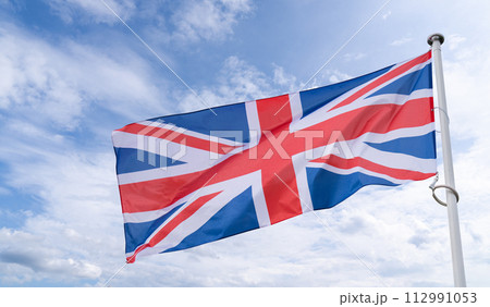British flag flutters in the wind. State symbol of United Kingdom 112991053