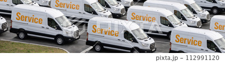 Service vans are parked in row. Commercial fleet 112991120