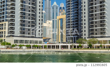 Residential buildings in Jumeirah Lake Towers timelapse in Dubai, UAE. Residential buildings in Jumeirah Lake Towers timelapse in Dubai, UAE. 112991605