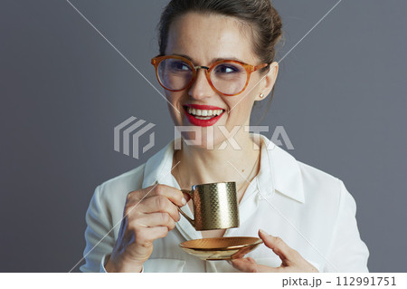 smiling 40 years old business woman isolated on grey smiling 40 years old business woman isolated on grey 112991751