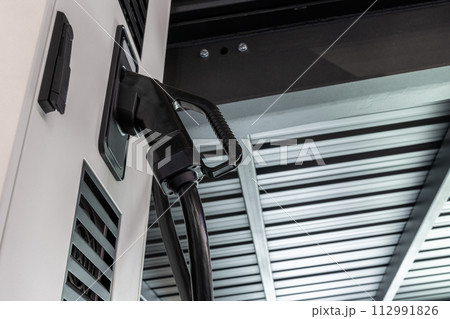 Electric vehicles charging station that takes energy from solar panels. Close up.. 112991826