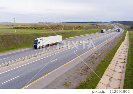 Trucks with trailers on the highway. Aerial view 112991906