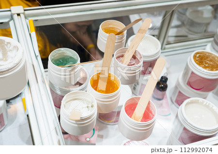 Showcase with cosmetics wax in the store. Showcase with cosmetics wax in the store. 112992074