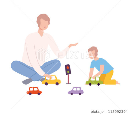 Father Sitting on the Floor with Crossed Legs and Playing Toy Cars with Her Son, Parent and Kid Spending Time Together at Home Flat Style Vector Illustratio 112992394