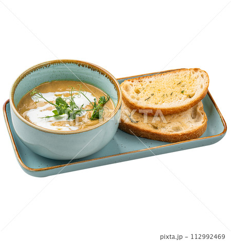Portion of gourmet restaurant yellow pea soup 112992469
