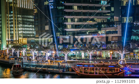 Dubai Marina towers and canal in Dubai night timelapse Dubai Marina towers and canal in Dubai night timelapse 112993105