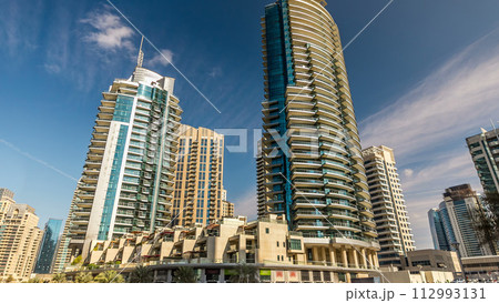 Dubai Marina towers in Dubai at day time timelapse Dubai Marina towers in Dubai at day time timelapse 112993131