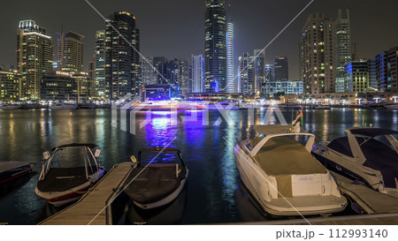 View of Dubai Marina towers and yahct in Dubai at night timelapse hyperlapse View of Dubai Marina towers and yahct in Dubai at night timelapse hyperlapse 112993140