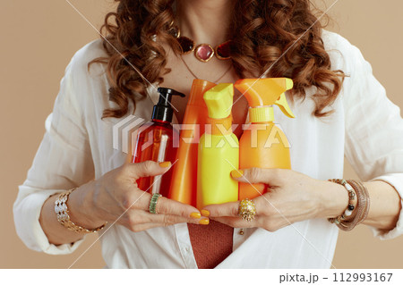 Trendy woman in blouse and shorts isolated on beige Trendy woman in blouse and shorts isolated on beige 112993167