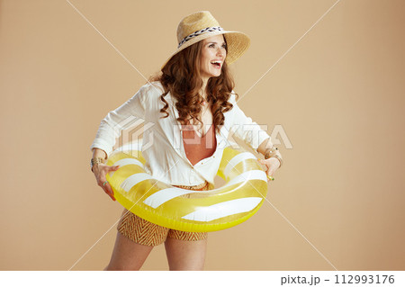 smiling elegant woman in blouse and shorts smiling elegant woman in blouse and shorts 112993176
