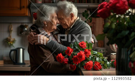 Flower bouquet, hug and senior couple with smile for celebration of marriage in kitchen of their house. 112993582