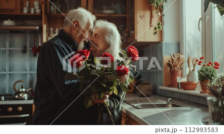 Flower bouquet, hug and senior couple with smile for celebration of marriage in kitchen of their house. 112993583
