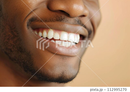 Detailed image of young man smiling with perfect white teeth Detailed image of young man smiling with perfect white teeth 112995270