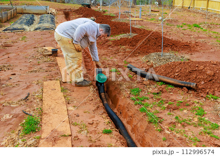 Installation of an underground drainage system to allow rainwater stormwater to exit Installation of an underground drainage system to allow rainwater stormwater to exit 112996574