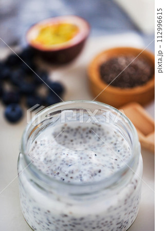 Chia pudding with  yogurt, mango and passion fruit, making process 112996615