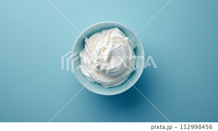 white ice cream over blue background 112998456