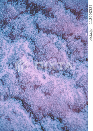 Abstract texture of the Dead sea salty shore. Salt crystals nature background in blue-purple color 112998525